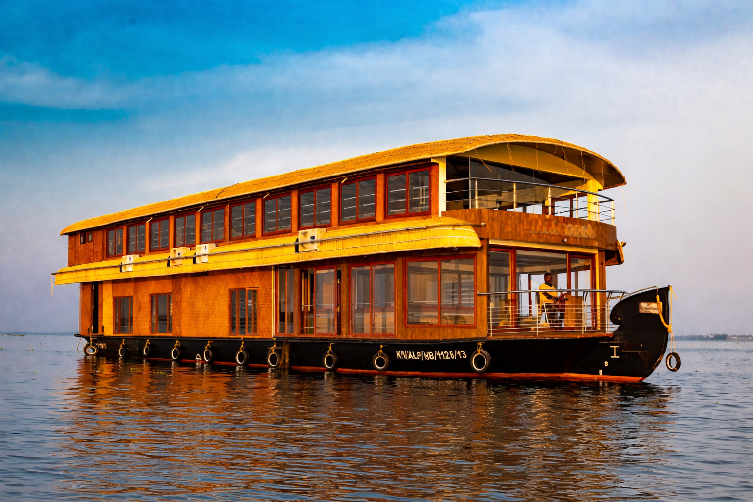 luxury kerala houseboat at sunset